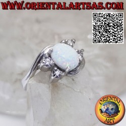 Silver ring with oval harlequin opal set and asymmetric zircons