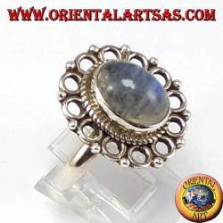 Silver ring, with oval rainbow moon stone and rim of circles