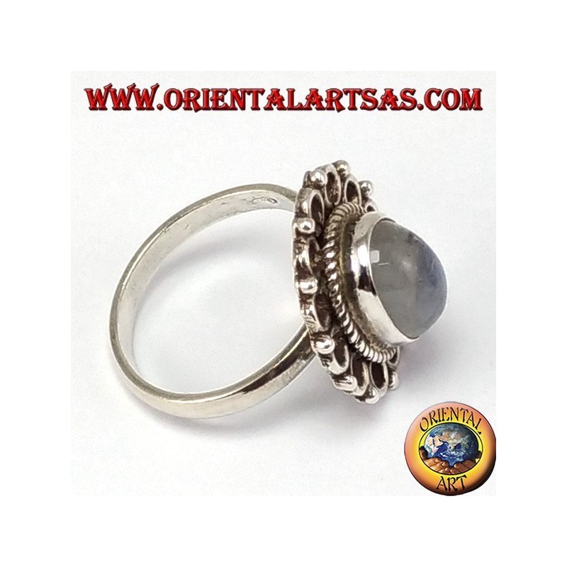 Silver ring, with oval rainbow moon stone and rim of circles