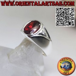 Silver ring with oval garnet set and asymmetric zircons