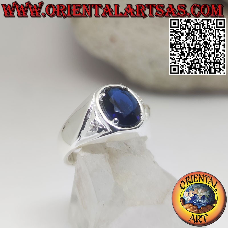 Silver ring with oval synthetic sapphire set and zircons