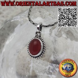 Silver pendant with carnelian oval cabochon surrounded by dots