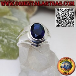 Silver ring with oval faceted synthetic sapphire on a smooth setting