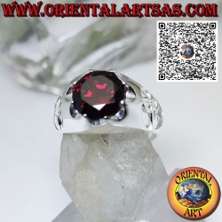 Silver ring with round garnet set and tyrone knot on the sides