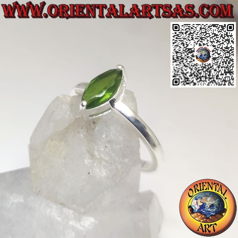 Silver ring set with faceted shuttle peridot