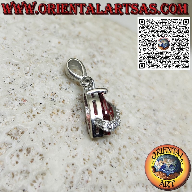 Silver pendant with shuttle garnet topped with zircons