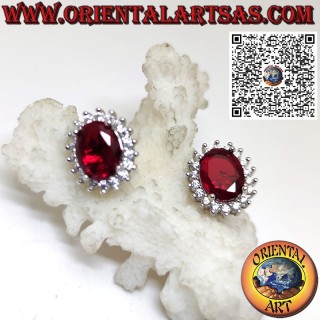 Silver lobe earrings with oval garnet surrounded by zircons