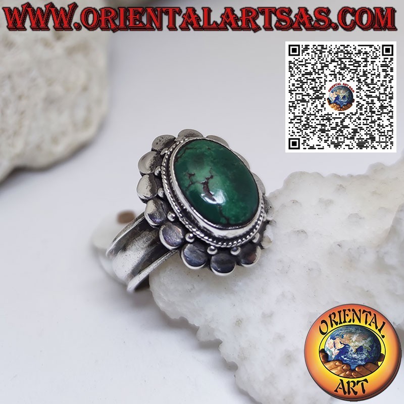 Silver ring with oval ancient Tibetan turquoise surrounded by studs