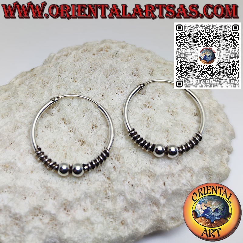 Bague en argent cercle de 25 mm. avec spirales et 2 sphères centrales