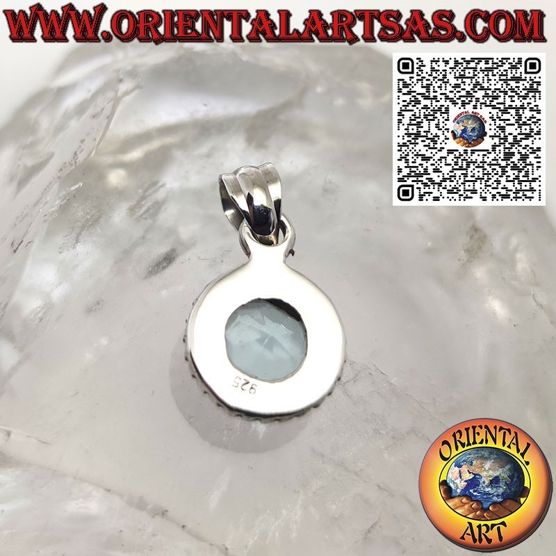 Silver pendant with round blue topaz surrounded by dots