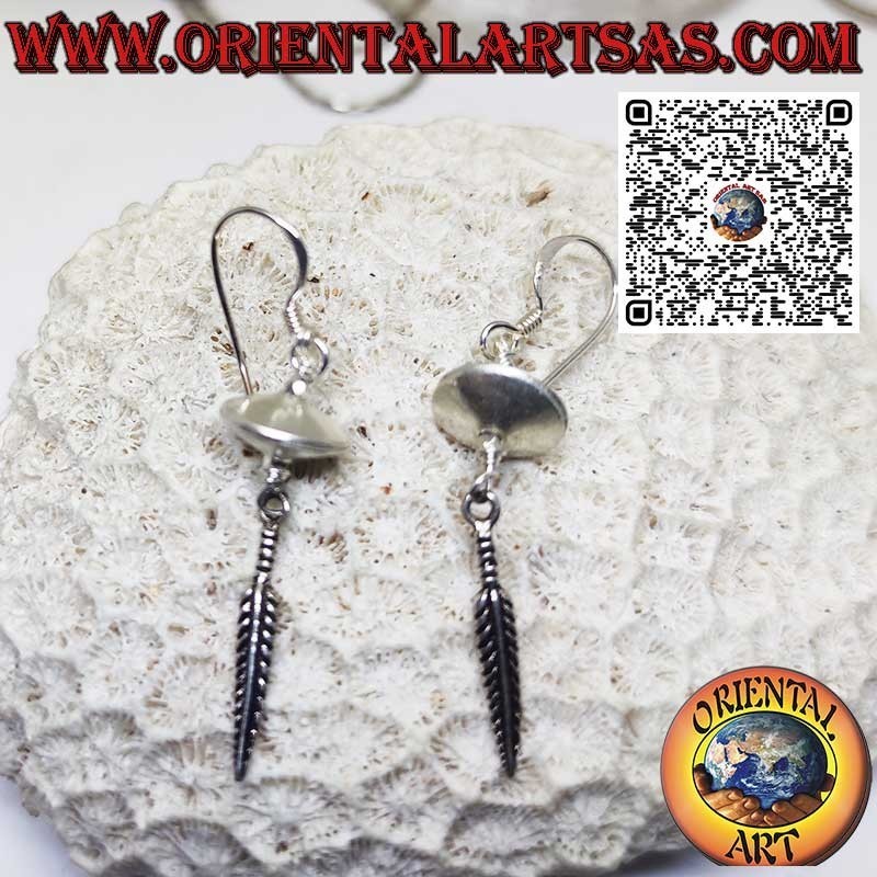 Silver earrings in the shape of a flying saucer spinning top with hanging feather