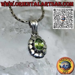 Silver pendant with natural oval peridot surrounded by studs