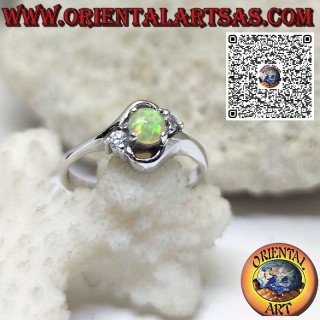 Oblique silver ring with round harlequin opal and two zircons