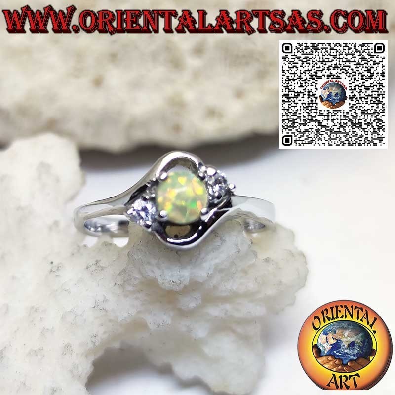 Oblique silver ring with round harlequin opal and two zircons