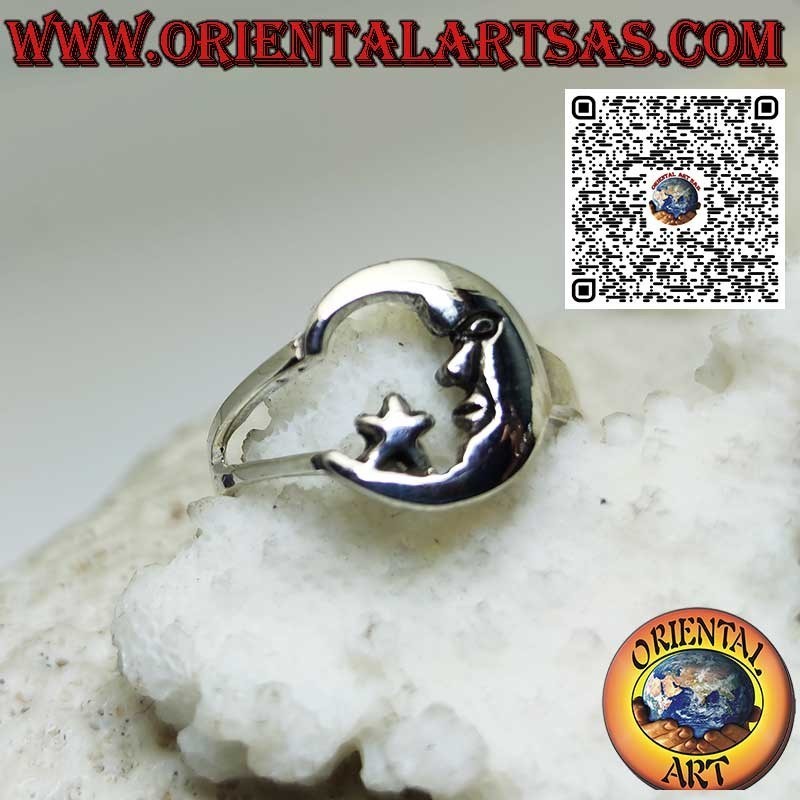 Silver ring depicting the moon with its face looking at the star
