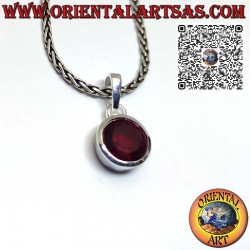 Silver pendant with round faceted garnet on a smooth setting