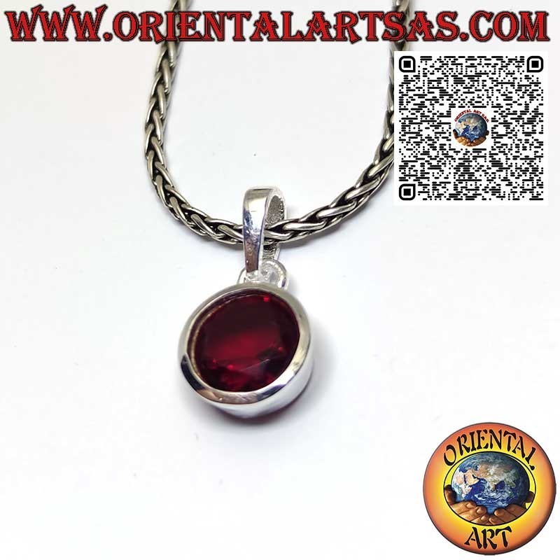Silver pendant with oval garnet on a smooth high setting