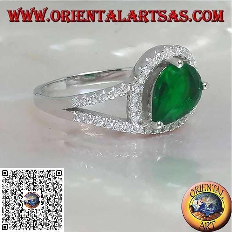 Silver ring with synthetic cross drop emerald set surrounded by zircons