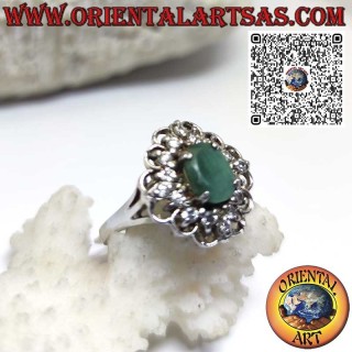 Silver ring with natural oval emerald surrounded by a circle and zircons