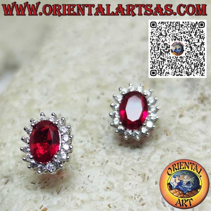 Silver lobe earrings with oval garnet surrounded by zirconia. small