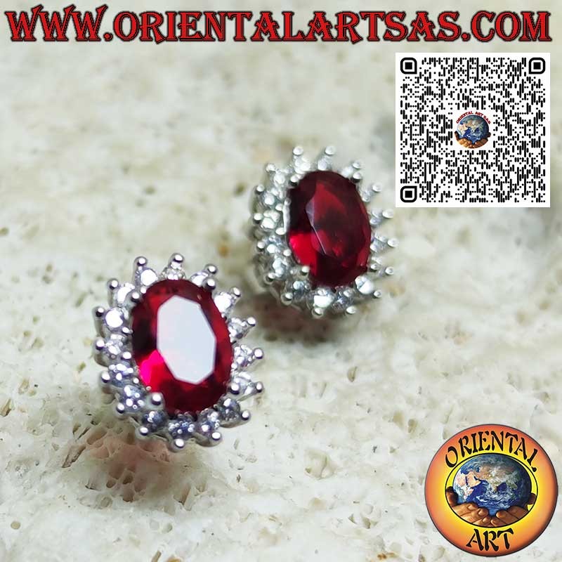 Silver lobe earrings with oval garnet surrounded by zirconia. small
