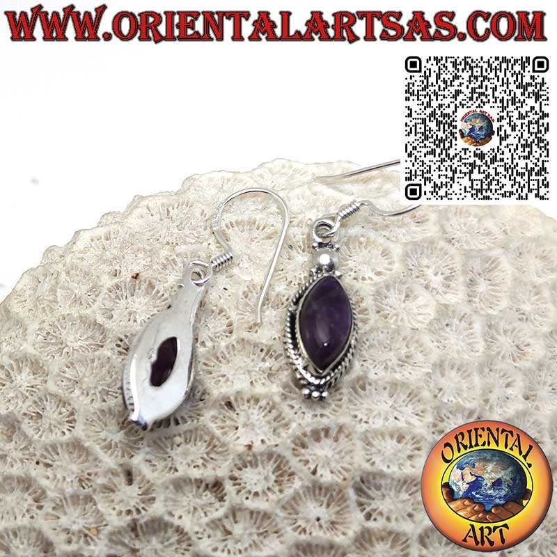 Silver earrings with a cabochon shuttle amethyst surrounded by braid