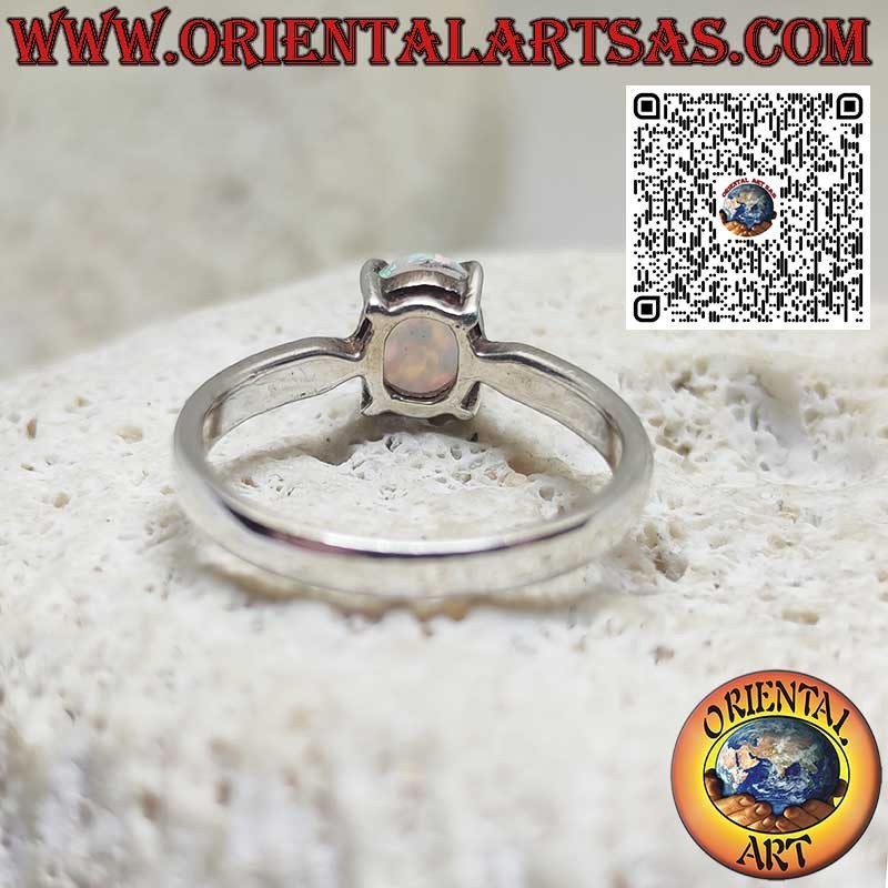Silver ring with oval harlequin opal set in 4 prongs
