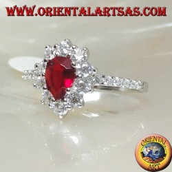 Silver ring with drop garnet set surrounded by cubic zirconia and row on the sides
