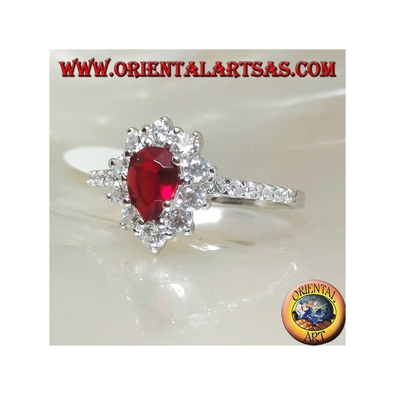 Silver ring with drop garnet set surrounded by cubic zirconia and row on the sides