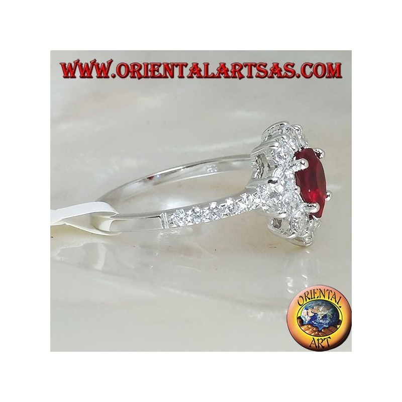 Silver ring with drop garnet set surrounded by cubic zirconia and row on the sides