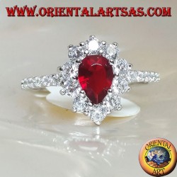 Silver ring with drop garnet set surrounded by cubic zirconia and row on the sides
