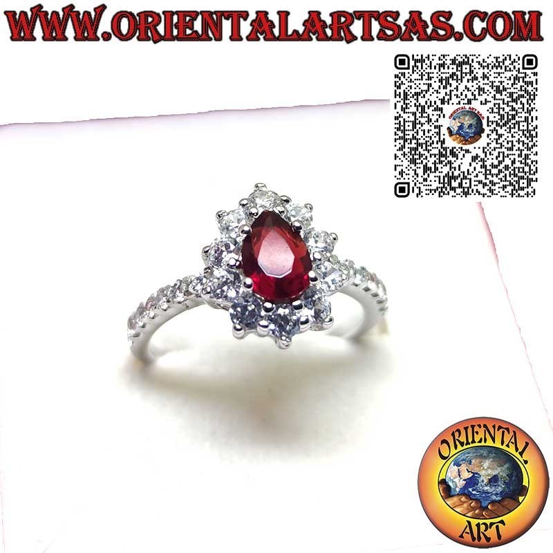 Silver ring with drop garnet set surrounded by cubic zirconia and row on the sides
