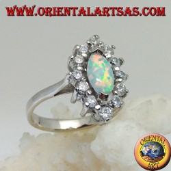 Silver ring with shuttle harlequin opal set on the tips surrounded by zircons