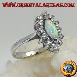 Silver ring with shuttle harlequin opal set on the tips surrounded by zircons
