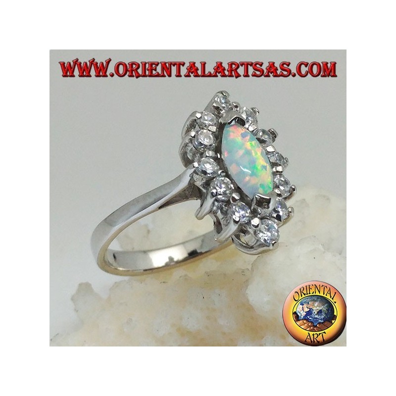 Silver ring with shuttle harlequin opal set on the tips surrounded by zircons