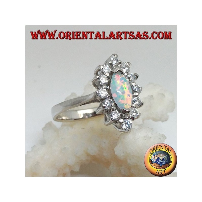 Anillo de plata con opalina arlequín lanzadera engastada en las puntas rodeadas de circonitas