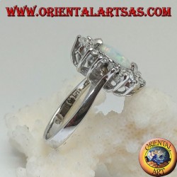 Silver ring with shuttle harlequin opal set on the tips surrounded by zircons