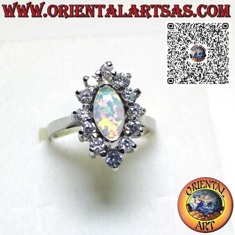 Silver ring with shuttle harlequin opal set on the tips surrounded by zircons