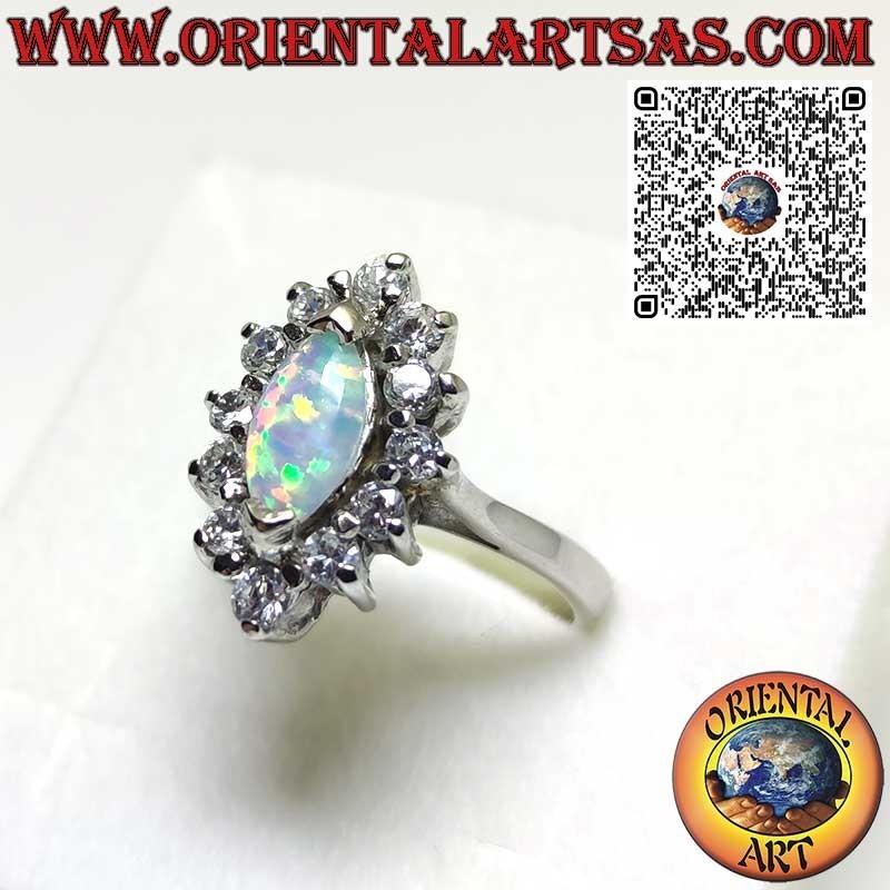 Bague en argent avec opale arlequin navette sertie sur les pointes entourée de zircons