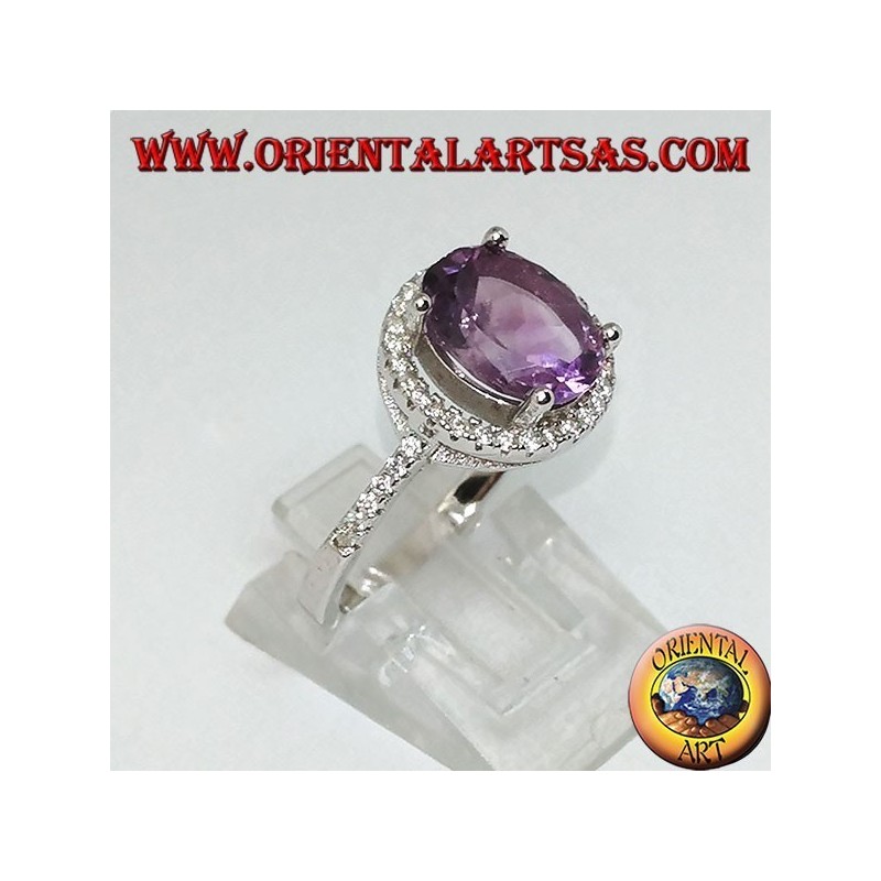 Silver ring with natural amethyst suspended on a circle of zircons