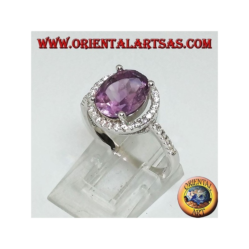 Silver ring with natural amethyst suspended on a circle of zircons