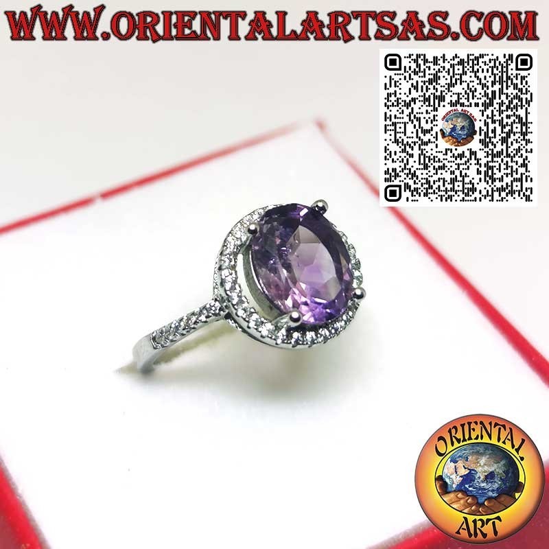 Silver ring with natural amethyst suspended on a circle of zircons