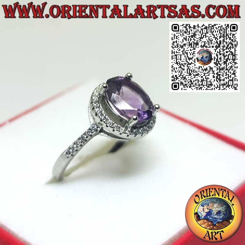 Silver ring with natural amethyst suspended on a circle of zircons