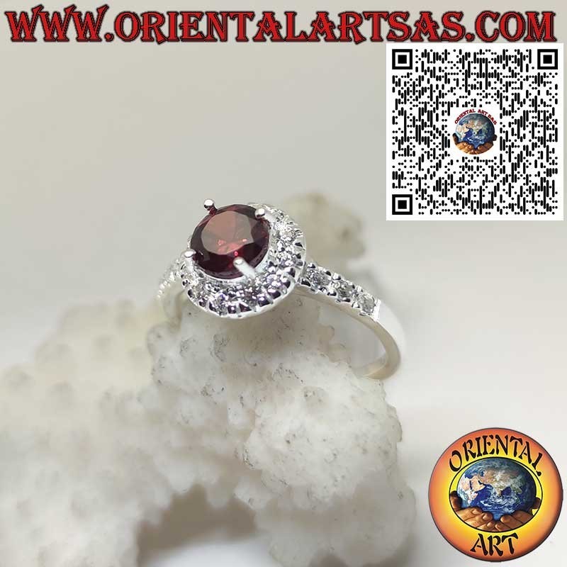 Sterling Silver Ring with Round Garnet and Side Zircon Accents