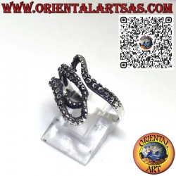 Silver ring, the three tentacles of the enveloping octopus