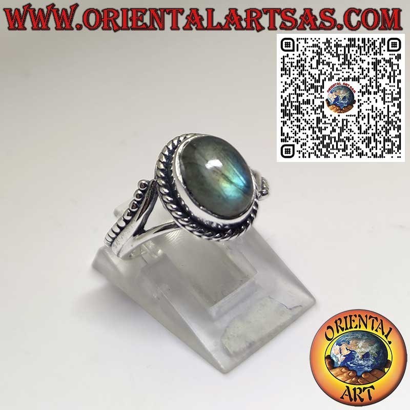 Silver ring with oval labradorite and serpentine on the sides