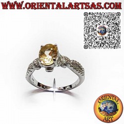 925 silver ring with oval yellow topaz and zircons. Symbol of energy and elegance.