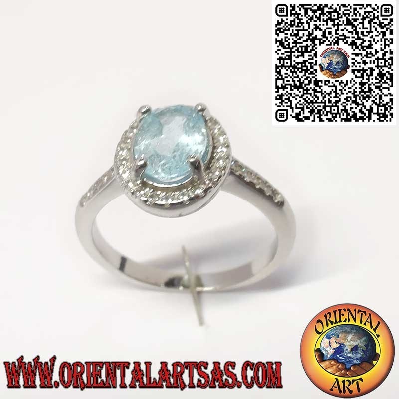 Anillo de Plata 925 con Topacio Azul Natural Ovalado Rodeado de Circonitas