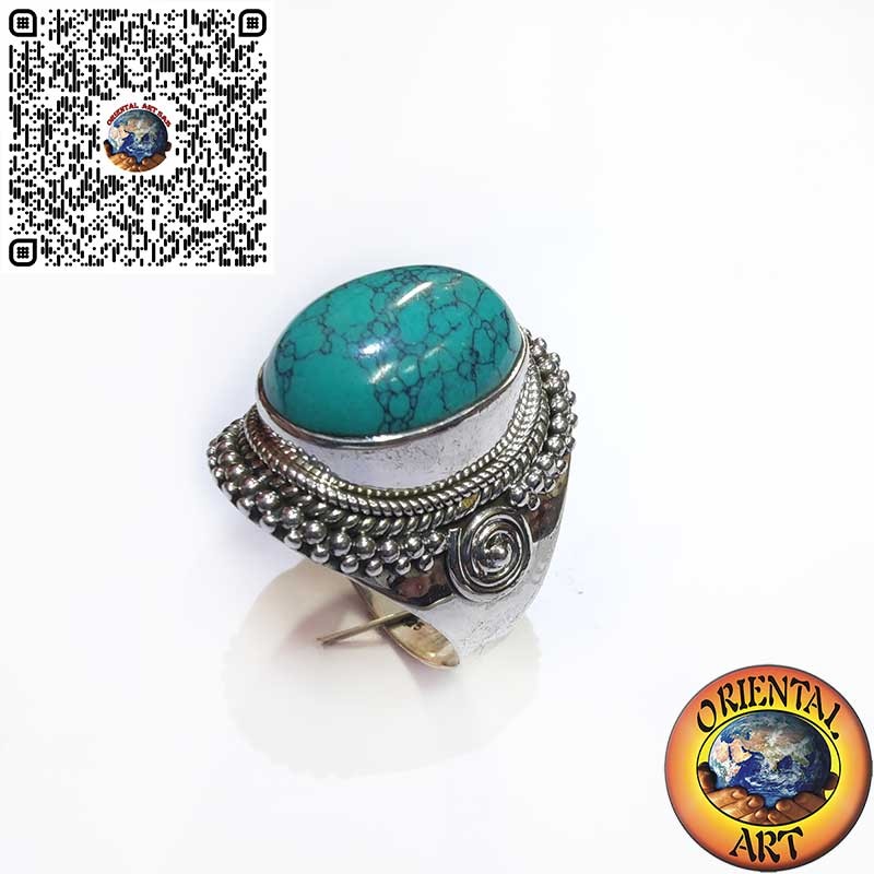 Sterling silver ring with large oval turquoise cabochon and braided edge.