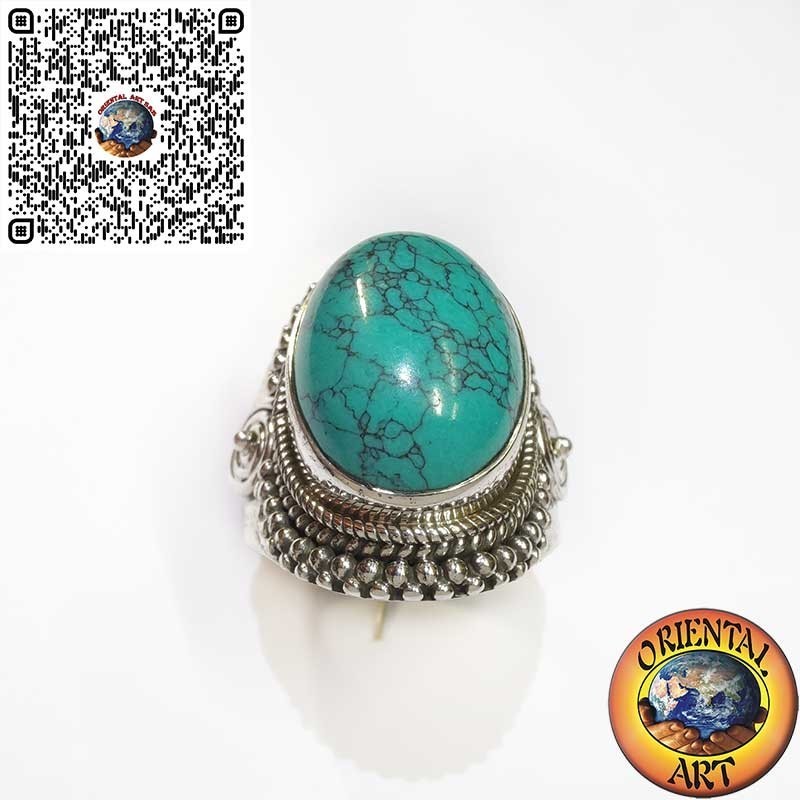 Silver ring with cabochon turquoise decorated with intertwining and spiral